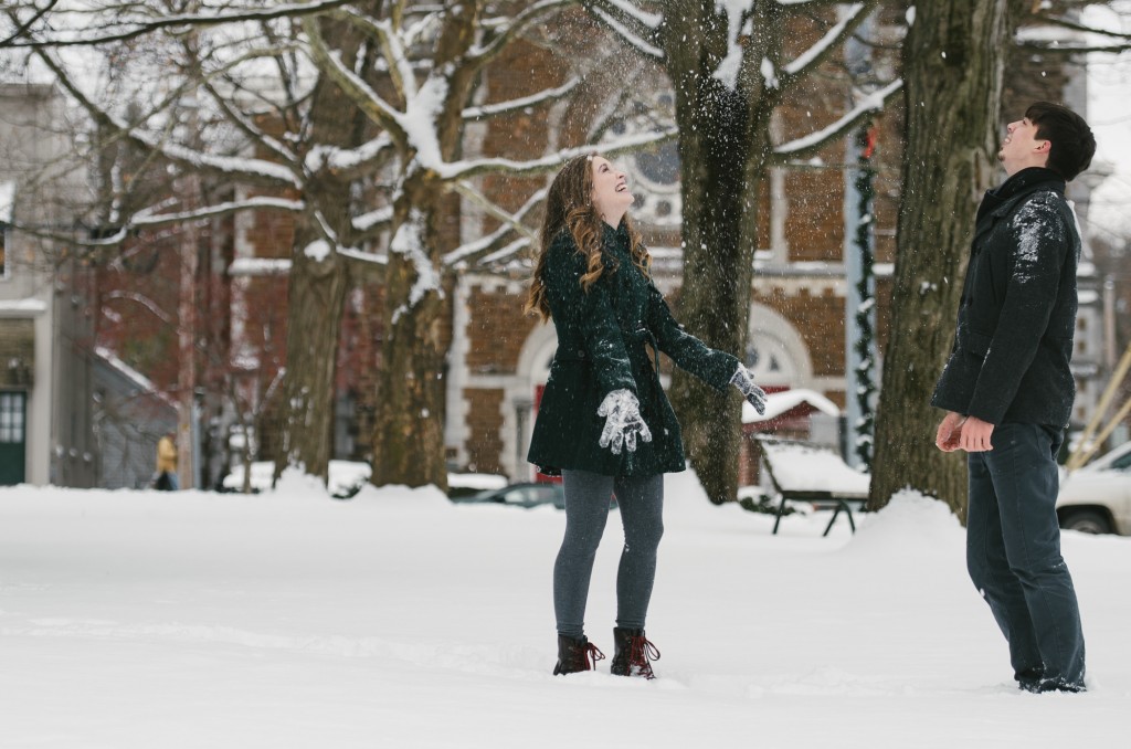 Tom Studios winter engagement session playing in snow