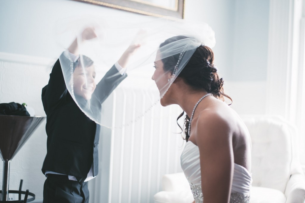Bride having fun with the kids  with Tom Studios Wedding Photography
