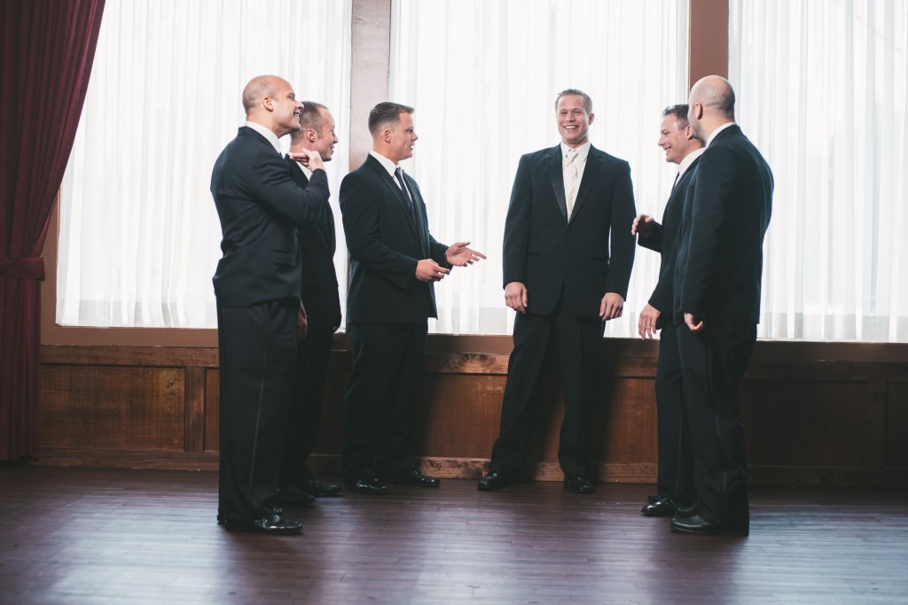 Groomsmen chatting  with Tom Studios Wedding Photography