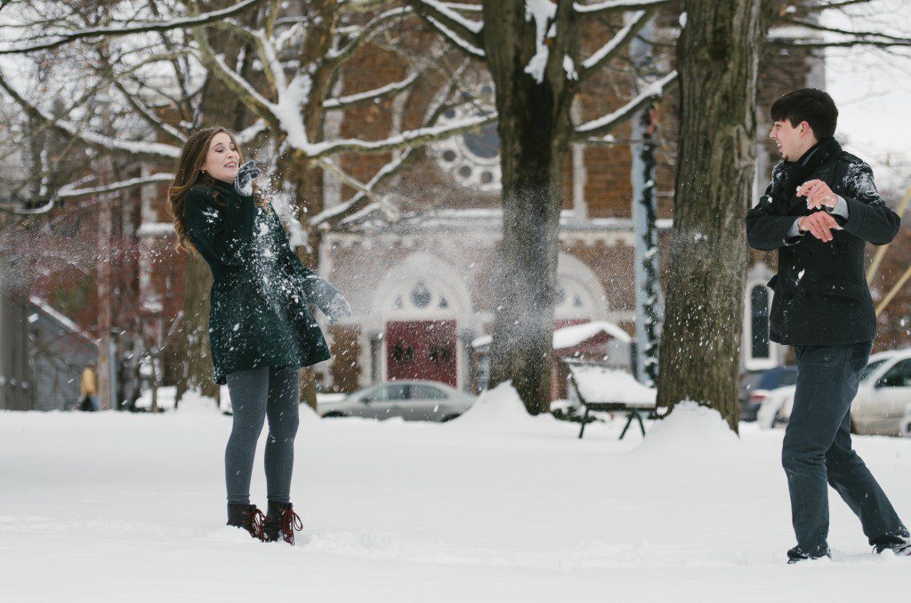 Tom Studios winter engagement session playing in snow