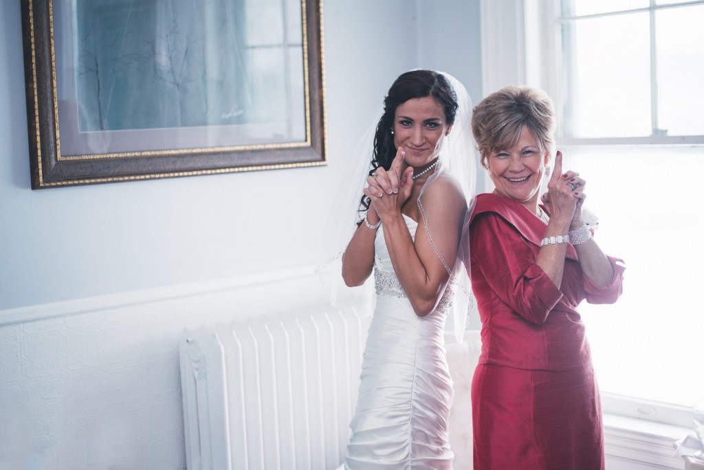 Bride and her Mom having fun  with Tom Studios Wedding Photography