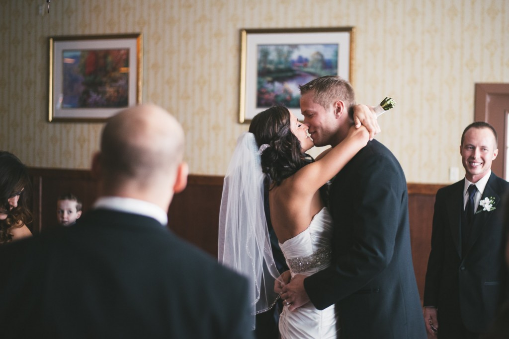 Bride and Groom kissing after ceremony with Tom Studios Wedding Photography  