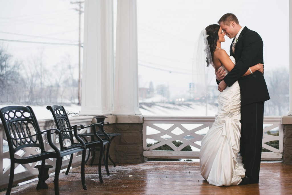 Bride and Groom on porch with Tom Studios Wedding Photography 